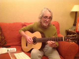 Taken a few weeks ago after the operation of me playing a lovely Santos Martinez guitar bought for a friend